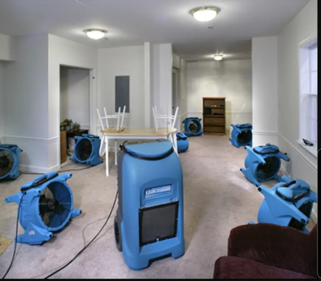 Air movers and dehumidifier setup for Water Damage Restoration in Waterboro